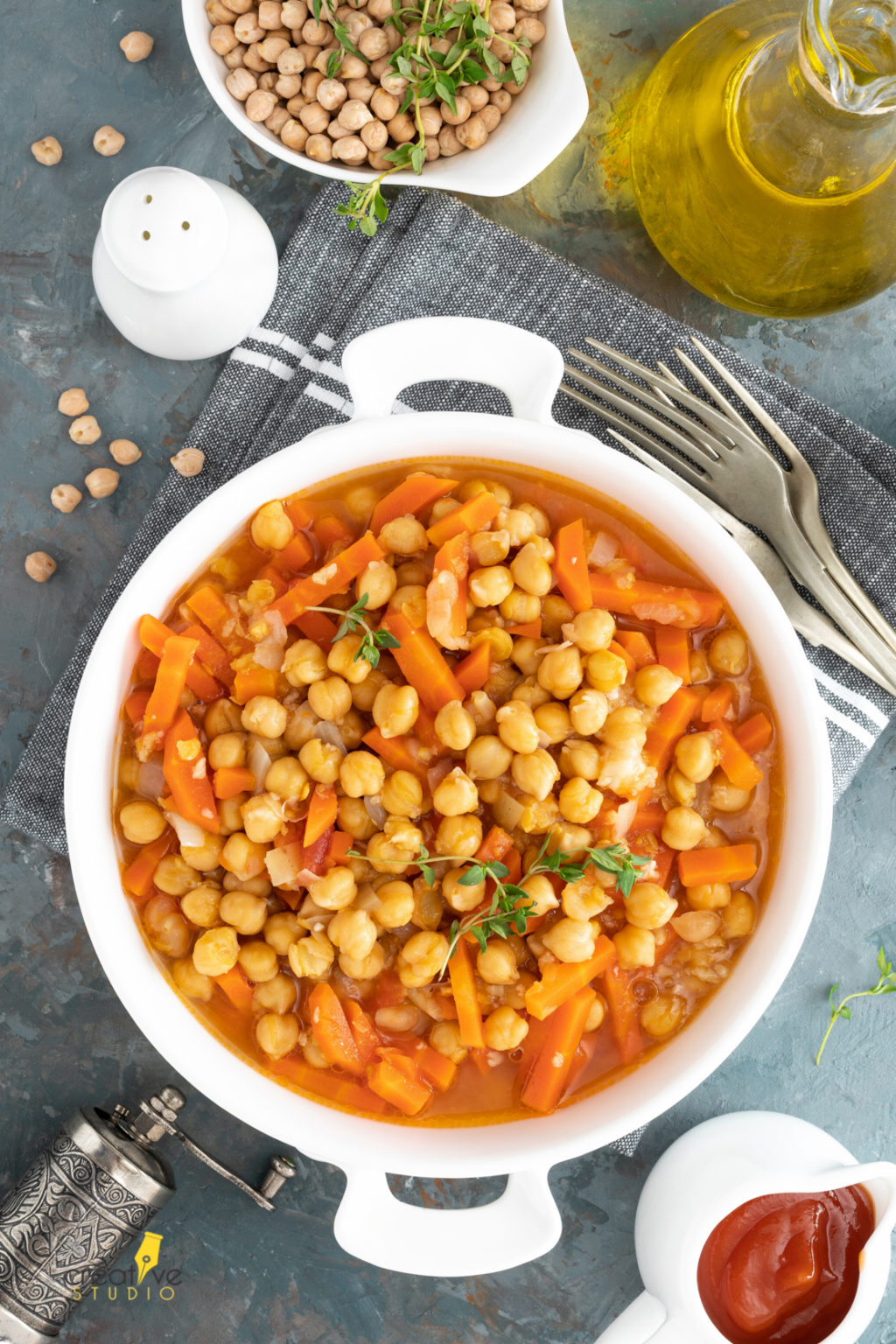 Chana Masala, spicy chickpea curry with carrot and onion in tomato sauce. Vegetarian dish for lunch. Indian cuisine